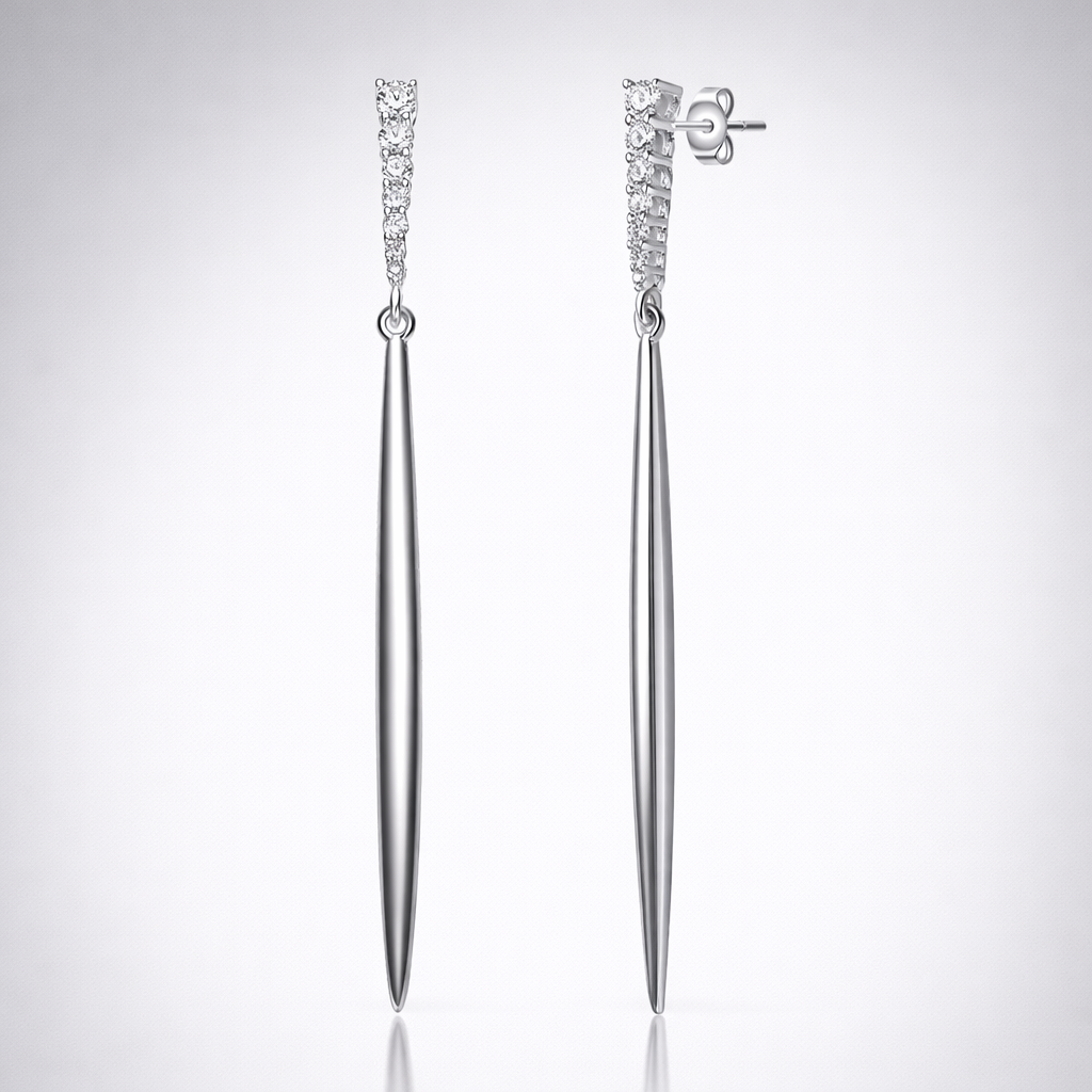 Pair of silver earrings with diamond accents on a light gray background