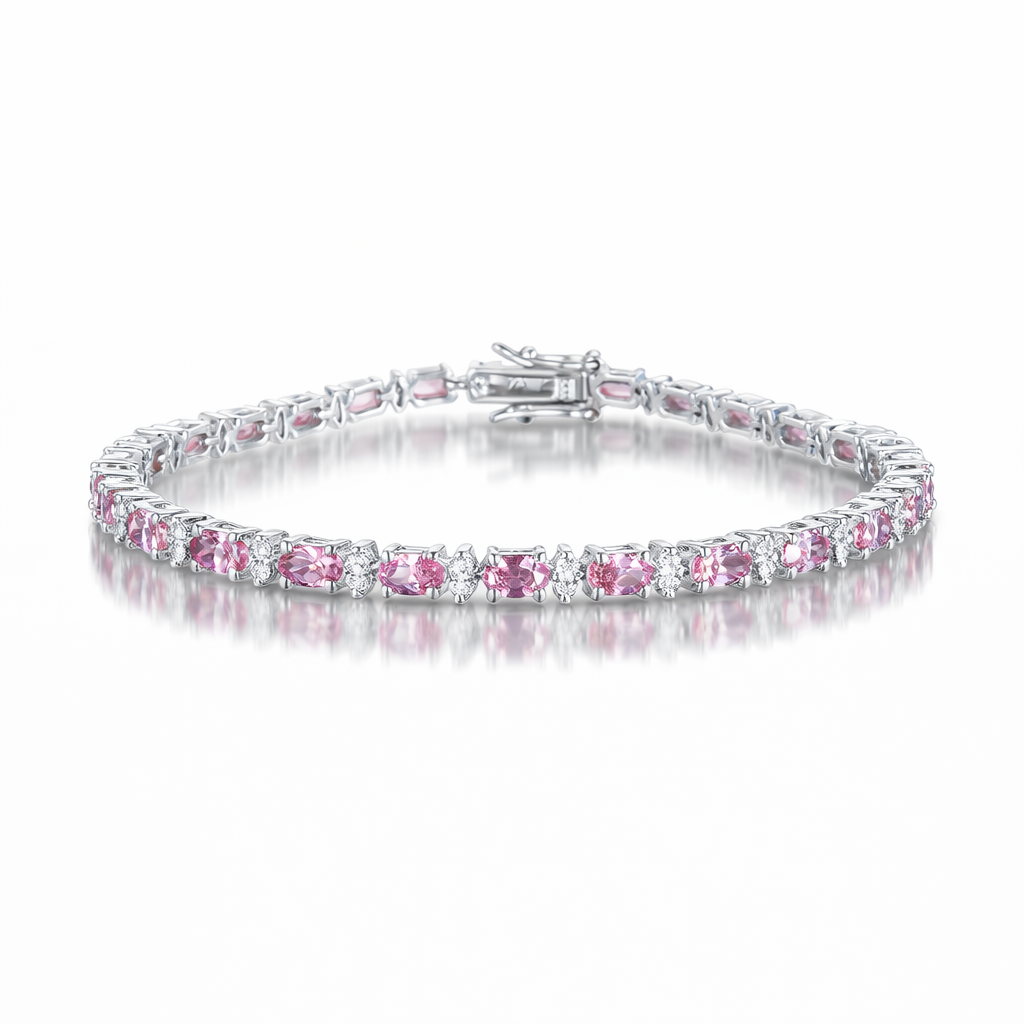 Silver bracelet with pink gemstones on a white background