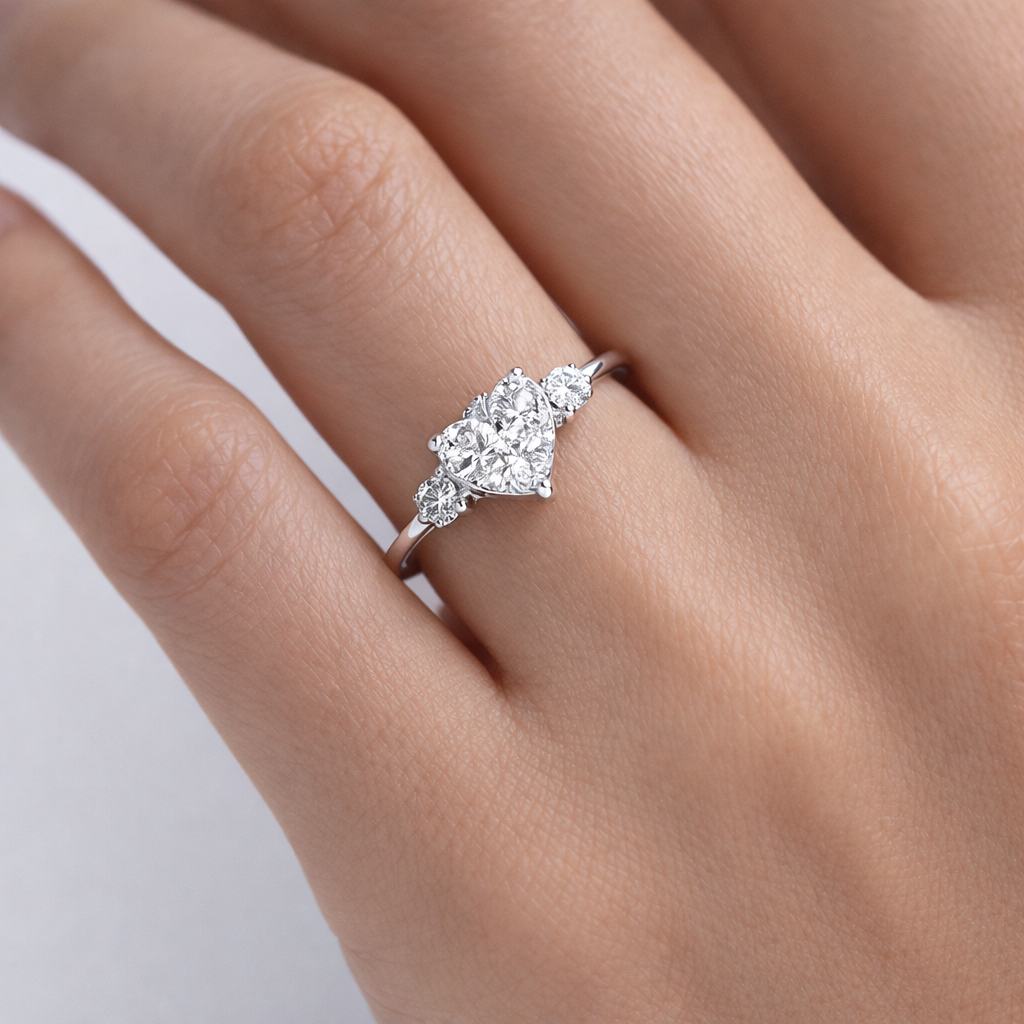 Diamond ring on a hand against a neutral background