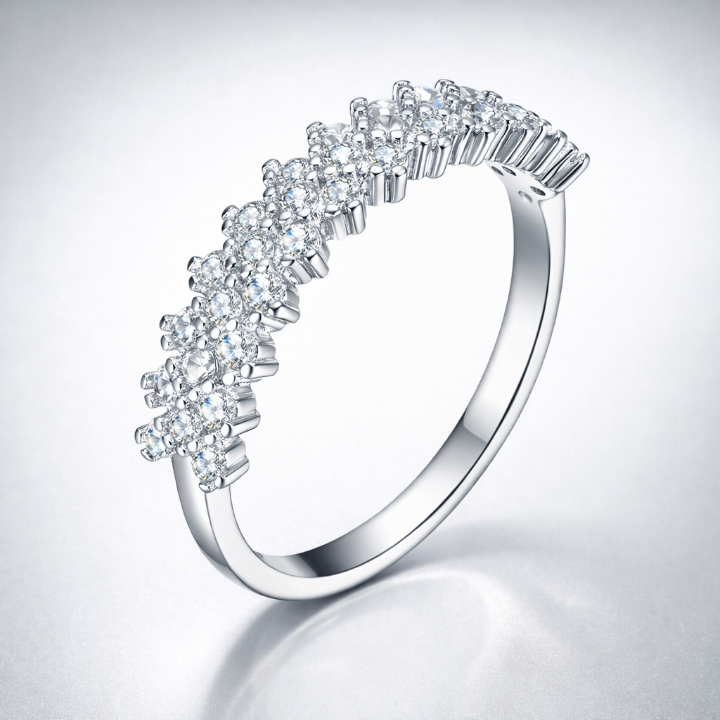 Silver ring with diamond accents on a light gray background